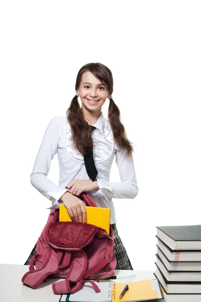 Happy girl collecting books — Stock Photo, Image