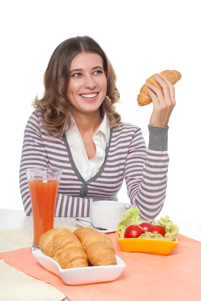 Happy woman with croissant — Stock Photo, Image