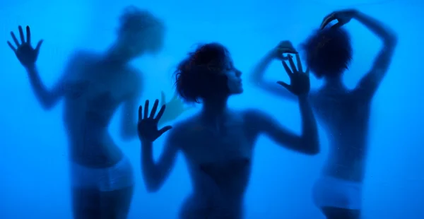 Moving and dancing silhouettes of women — Stock Photo, Image
