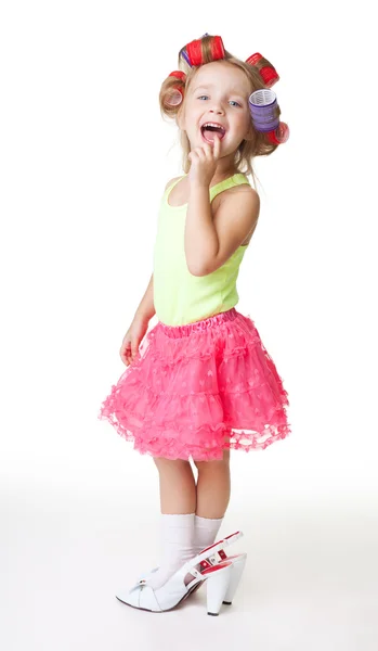 I'm fashion says little girl in women's shoes and rollers — Stock Photo, Image