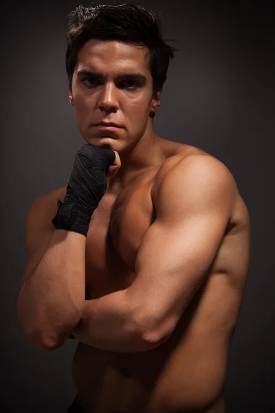 Handsome muscular man thinking — Stock Photo, Image