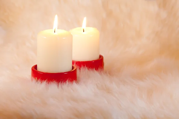 Candles on home like fur background — Stock Photo, Image