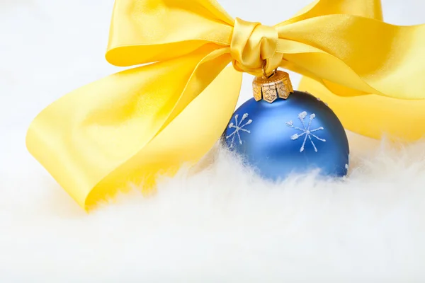 Christmas ball with yellow ribbon bow — Stock Photo, Image