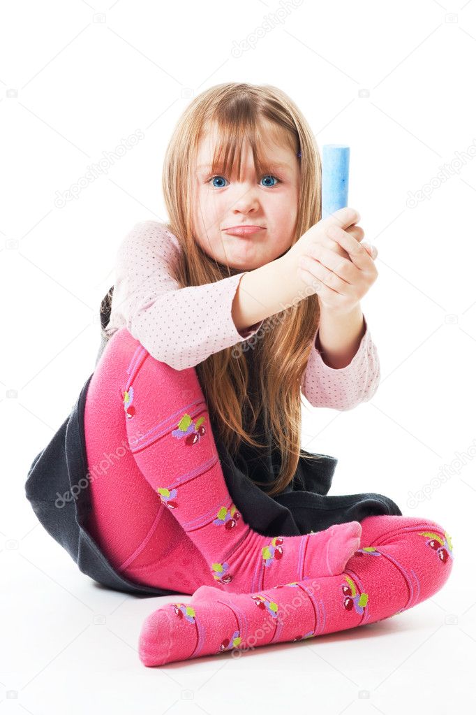 Angry little girl with chalk