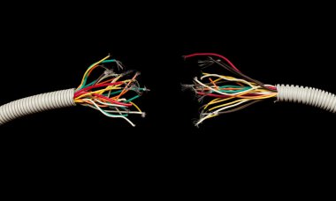 Torn apart wires isolated on black clipart