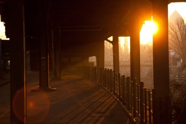 Sunrise in the morning from Hallesches subway station clipart