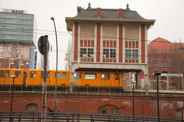 Yellow electric train on the Warschauer Straße — Stok fotoğraf