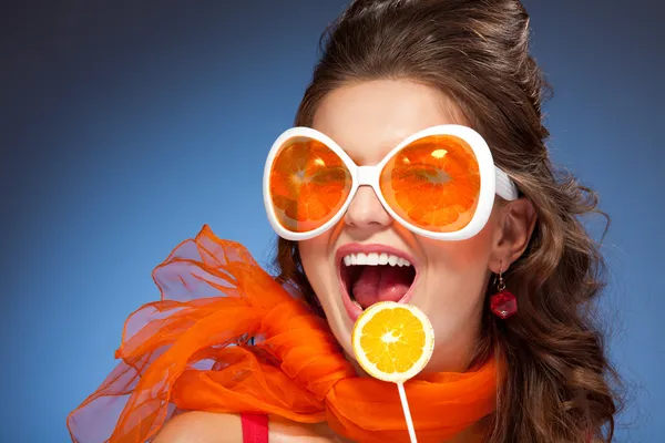 Woman with citrus lollipop — Stock Photo, Image
