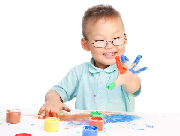 Chinese boy painting with hands — Stock Photo, Image