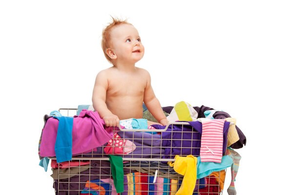 Baby in basket with clothes