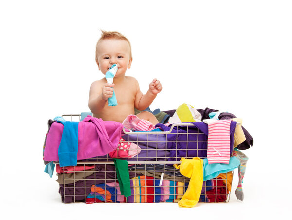 Toddler in basket with clothes