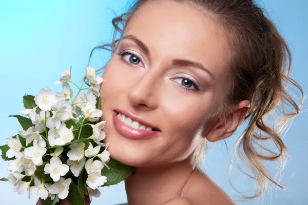 Beauty portrait and jasmine flowers — Stock Photo, Image