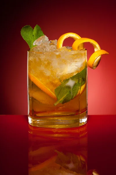 Orange drink with ice and mint — Stock Photo, Image