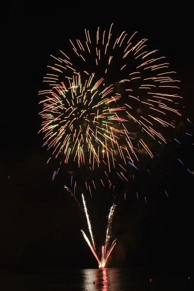 stock image Fireworks - large flower-like display over water