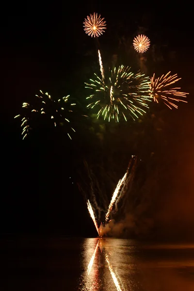 Fireworks over water — Stock Photo, Image