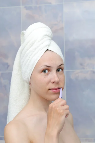 Donna con uno spazzolino da denti — Foto Stock