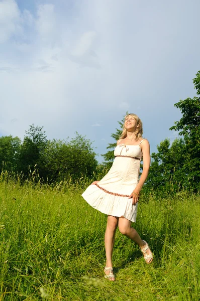 Dancing woman on the meadow Stock Image