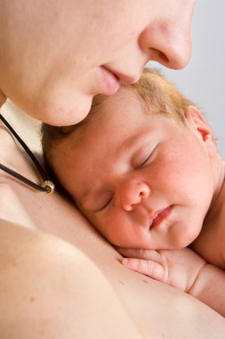 Picture of mother with slepping baby clipart