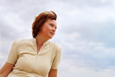 Portrait of a woman in the clouds clipart