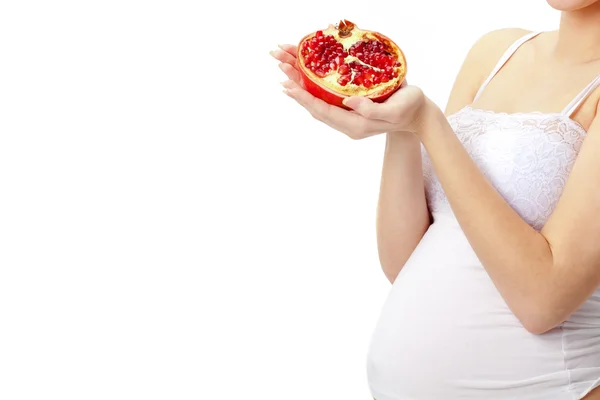 Těhotná žena s granátovým jablkem — Stock fotografie