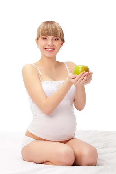 Těhotná žena s jablkem — Stock fotografie