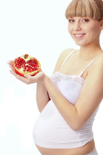 Zwangere vrouw met granaatappel — Stockfoto