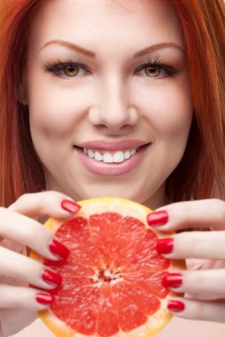 Red woman holding grapefruit clipart