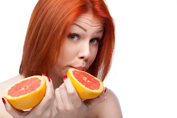 Red woman holding grapefruit — Stock Photo, Image