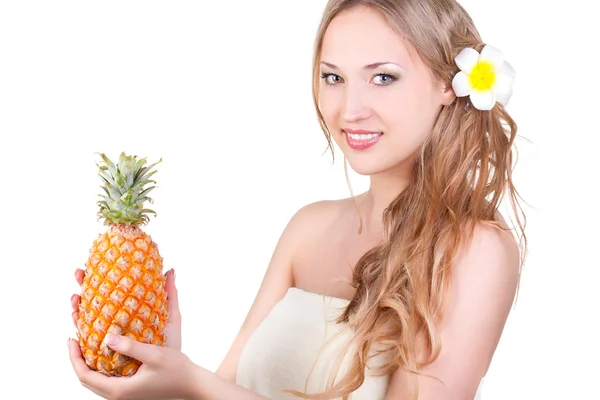 Beautiful woman holding pineapple — Stock Photo, Image
