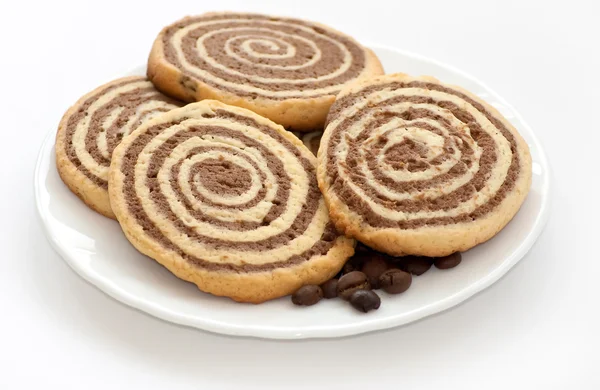 Black and white cookies with coffee beans on the plate — Stock Photo, Image