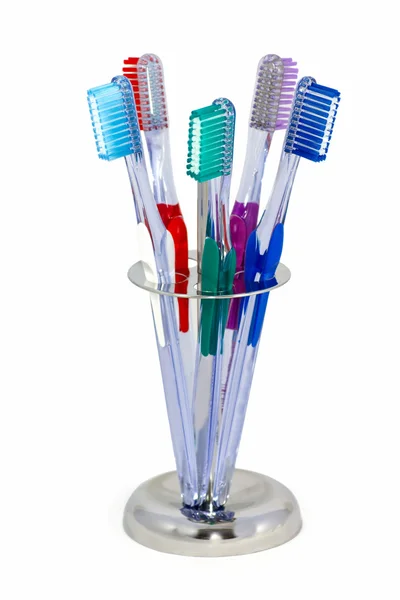 Fem tandborstar i en stål hållare — Stockfoto