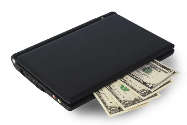 Деньги на ноутбук — стоковое фото