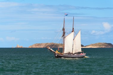 Mast schooner at sea clipart