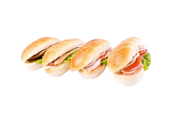 Beyaz zemin üzerine dört sandviç — Stok fotoğraf