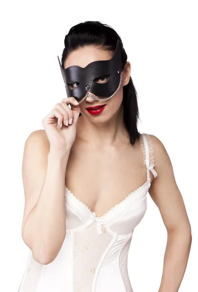 Uma menina com uma máscara preta e um ventilador — Fotografia de Stock