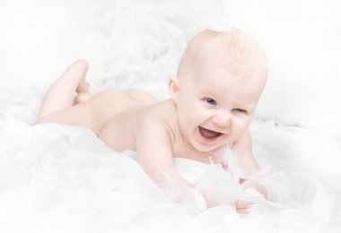 Portrait of happy baby with feather on white background clipart