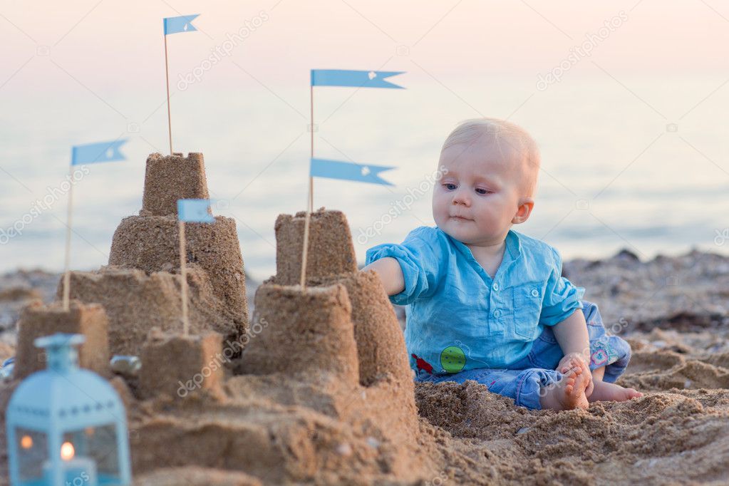 Baby boy playing on beach