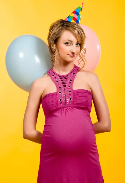 Lovely pregnant young woman with balloons — Stock Photo, Image
