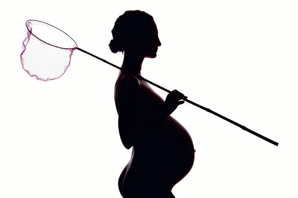 Силуэт беременной женщины — стоковое фото