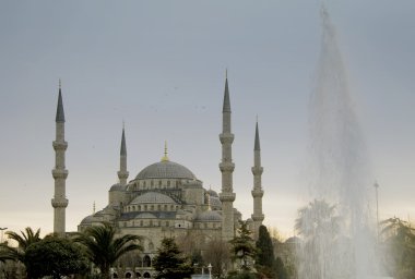 Sultanahmet mosque and a fountain clipart