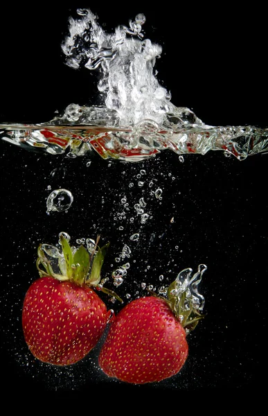 Strawberries in water — Stock Photo, Image