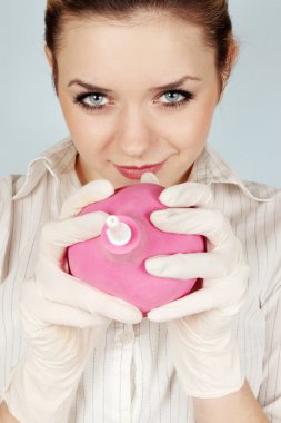 Girl holds the enema clipart