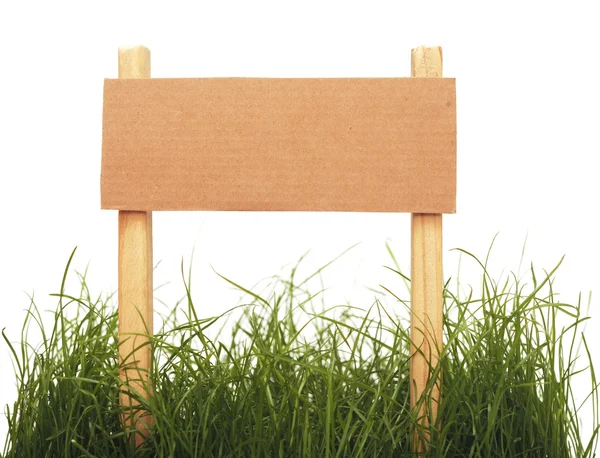 Pappschild mit Gras isoliert auf weißem Hintergrund — Stockfoto