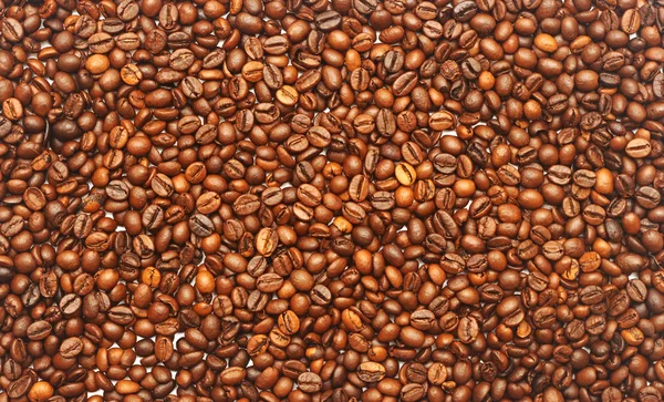 Heap de grãos de café-útil fundo natural marrom para o seu de — Fotografia de Stock