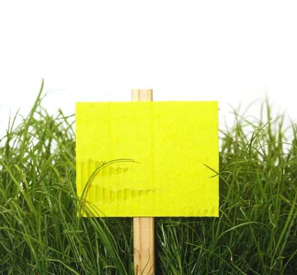 Cardboard sign with grass — Stock Photo, Image