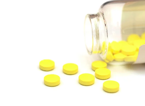 Χάπια σε φιαλίδιο που απομονώνονται σε λευκό φόντο — Φωτογραφία Αρχείου