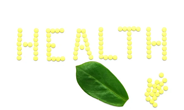 Word sağlık üzerinde beyaz izole sarı ilaçlar hap imal — Stok fotoğraf