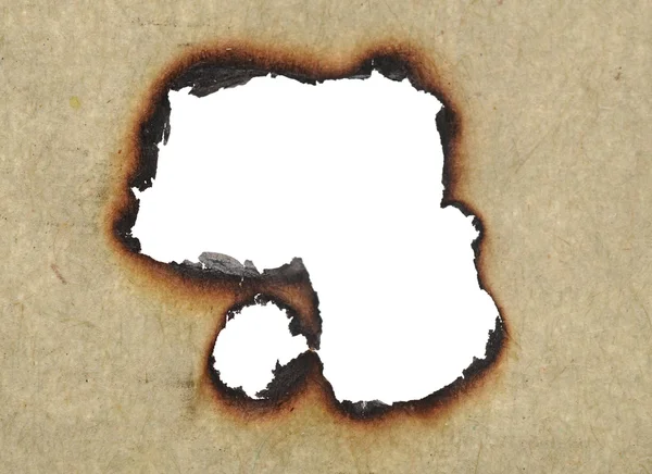 Buracos queimados em papel velho — Fotografia de Stock