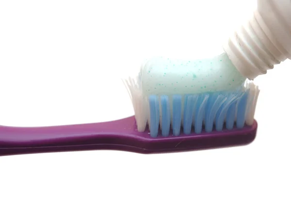 Nahaufnahme einer Zahnbürste und Zahnpasta — Stockfoto