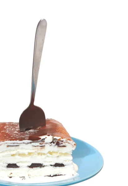 Ice cream with a spoon on blue plate — Stock Photo, Image